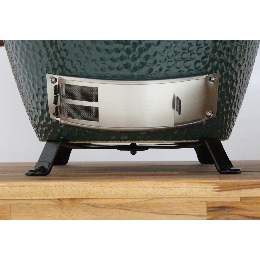 Side view of a Big Green Egg Table Nest supporing a Large Egg on an Acacia Table.