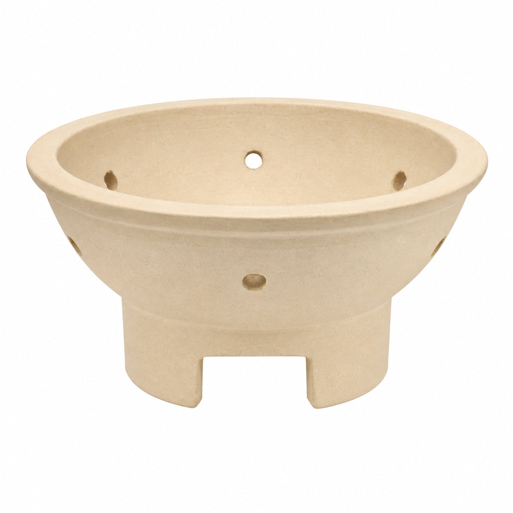 Kamado Joe Jr. replacement ceramic firebox showing the airflow holes and lower intake opening that aligns with the sliding draft vent.