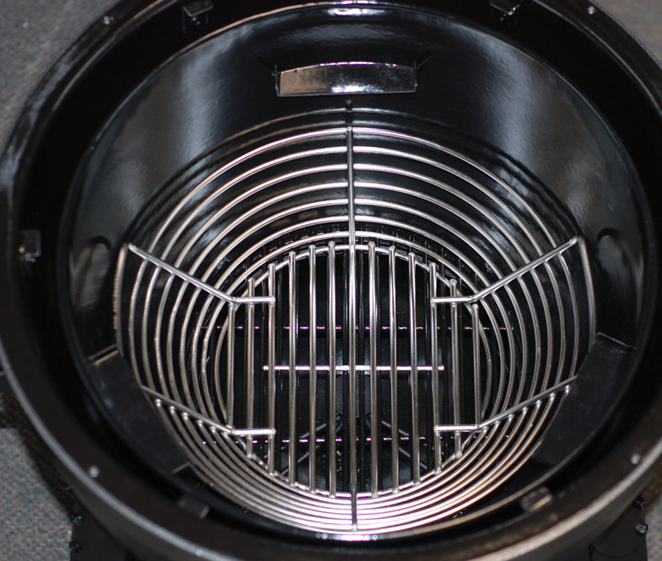 Kick Ash Charcoal Basket sitting down inside the Char-Griller AKORN firebowl.