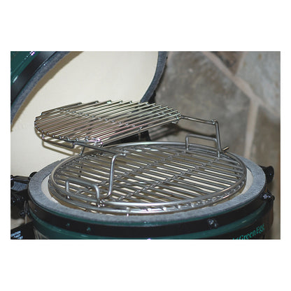 Angled top view of sliding second grid bundle on MiniMax CGS Woo in the Minimax Big Green Egg. The top grid is pushed back showing how to access the lower grid on the Woo.