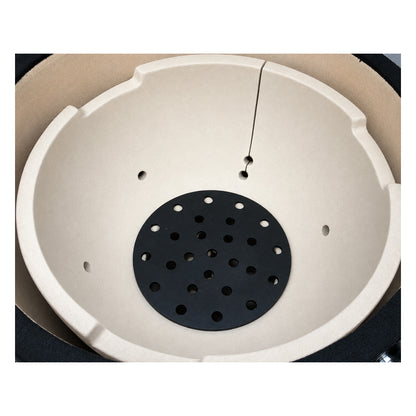Top-down view of a Primo Kamado Round ceramic firebox installed inside the grill (charcoal grate not included).