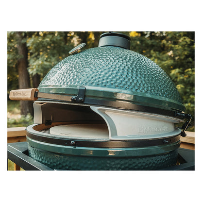 Angled view from the side of the XL Big Green EGG set up with the XL Pizza Wedges (sku 136688). Dome is closed and pizza stone is visible through wedge opening and about 1 inch below felt line.