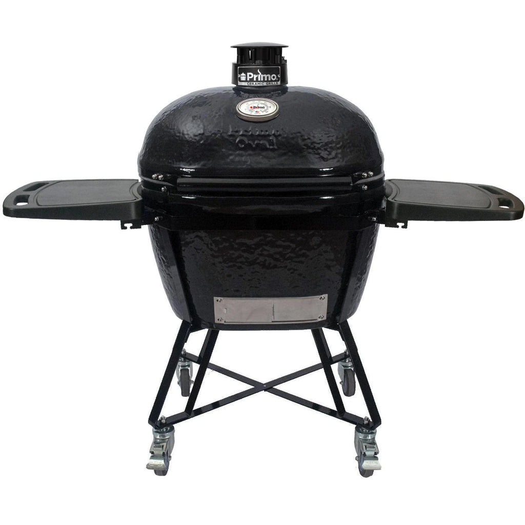 Front view of Primo XL Oval All-In-One ceramic grill package PGCXLC including metal cart, side shelves, and accessories.