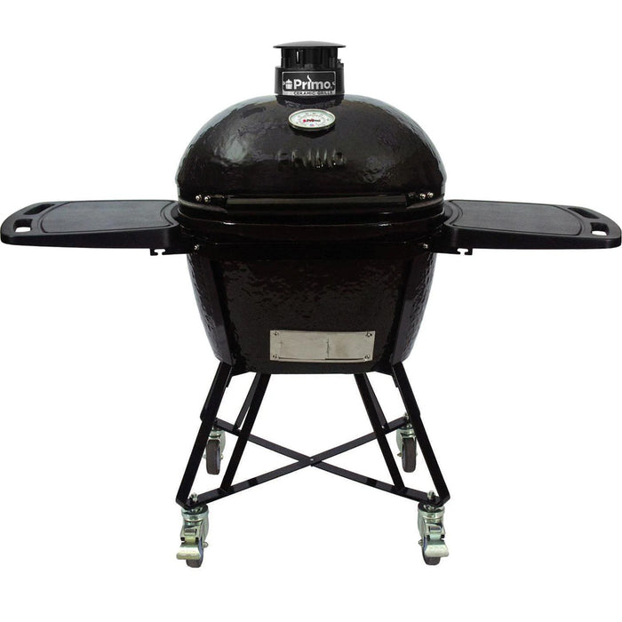 Large Primo Oval All-In-One Grill with grill, cart, heat deflectors & deflector racks, lump divider, ash tool and grid gripper.